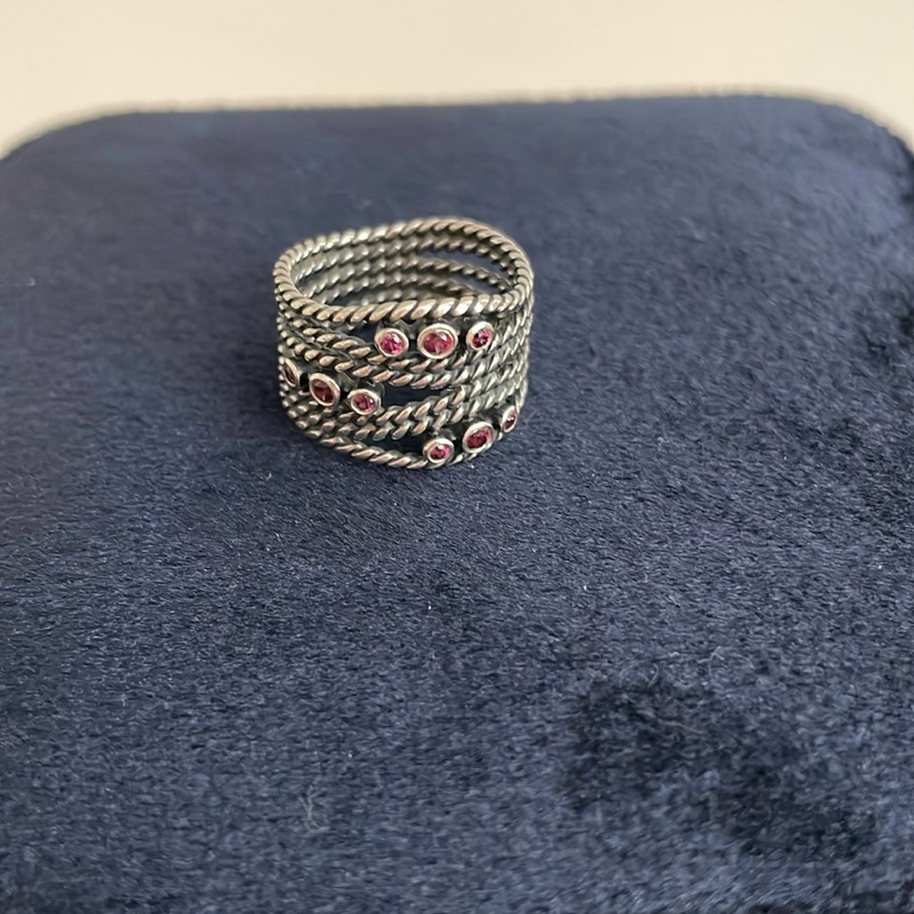 Pandora ring with pink/purplish stones